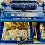 Front window with blue frame of Books Upstairs Bookstore in Dublin with their upstairs cafe and famous bay window